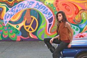 The car was parked perfectly next to the mural. All it needed was a little something.